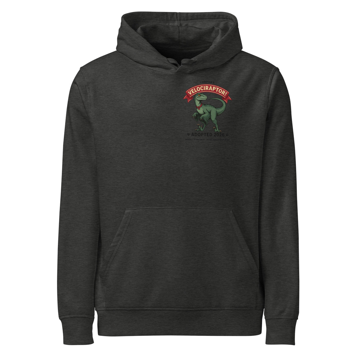 I Adopted a Velociraptor hoodie in charcoal heather, front view, with a small left-chest print: green raptor under a red banner