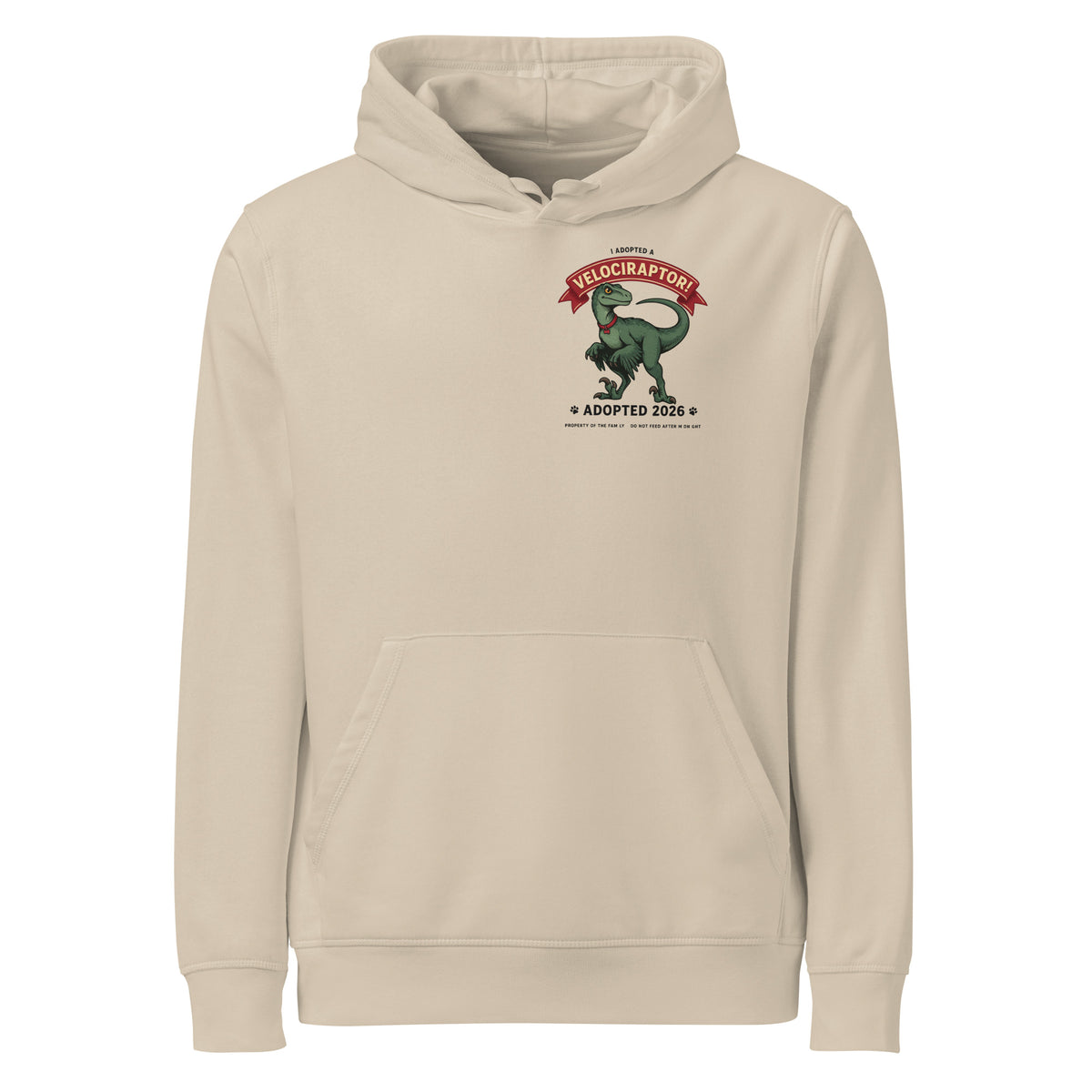 I Adopted a Velociraptor hoodie in sand, front view, with a small left-chest print: green raptor under a red banner